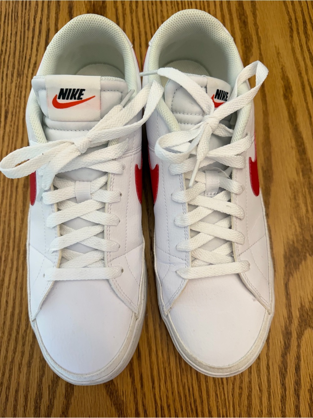 Nike White Low-Top Sneakers with Red Swoosh